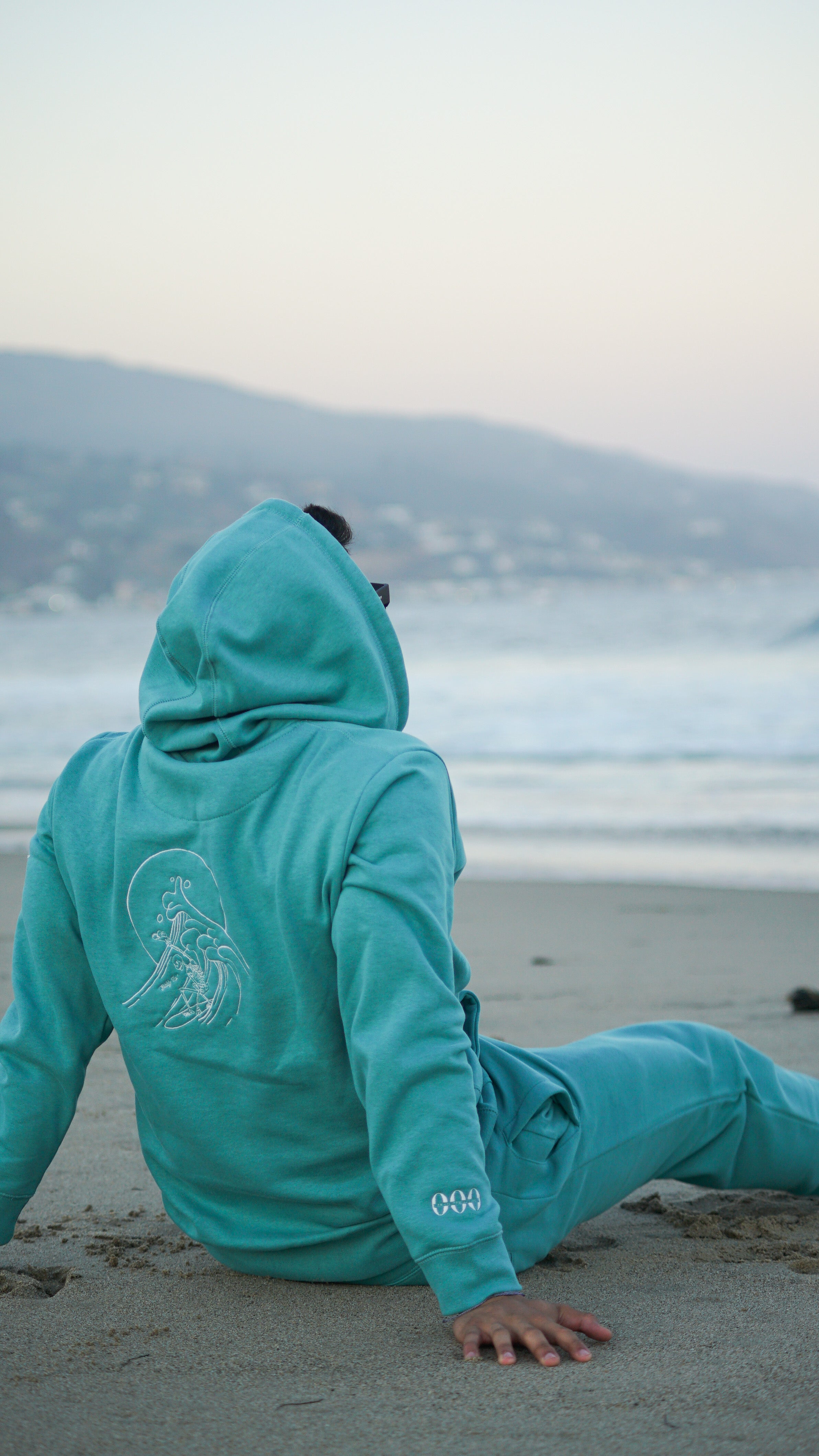 man sitting on beach